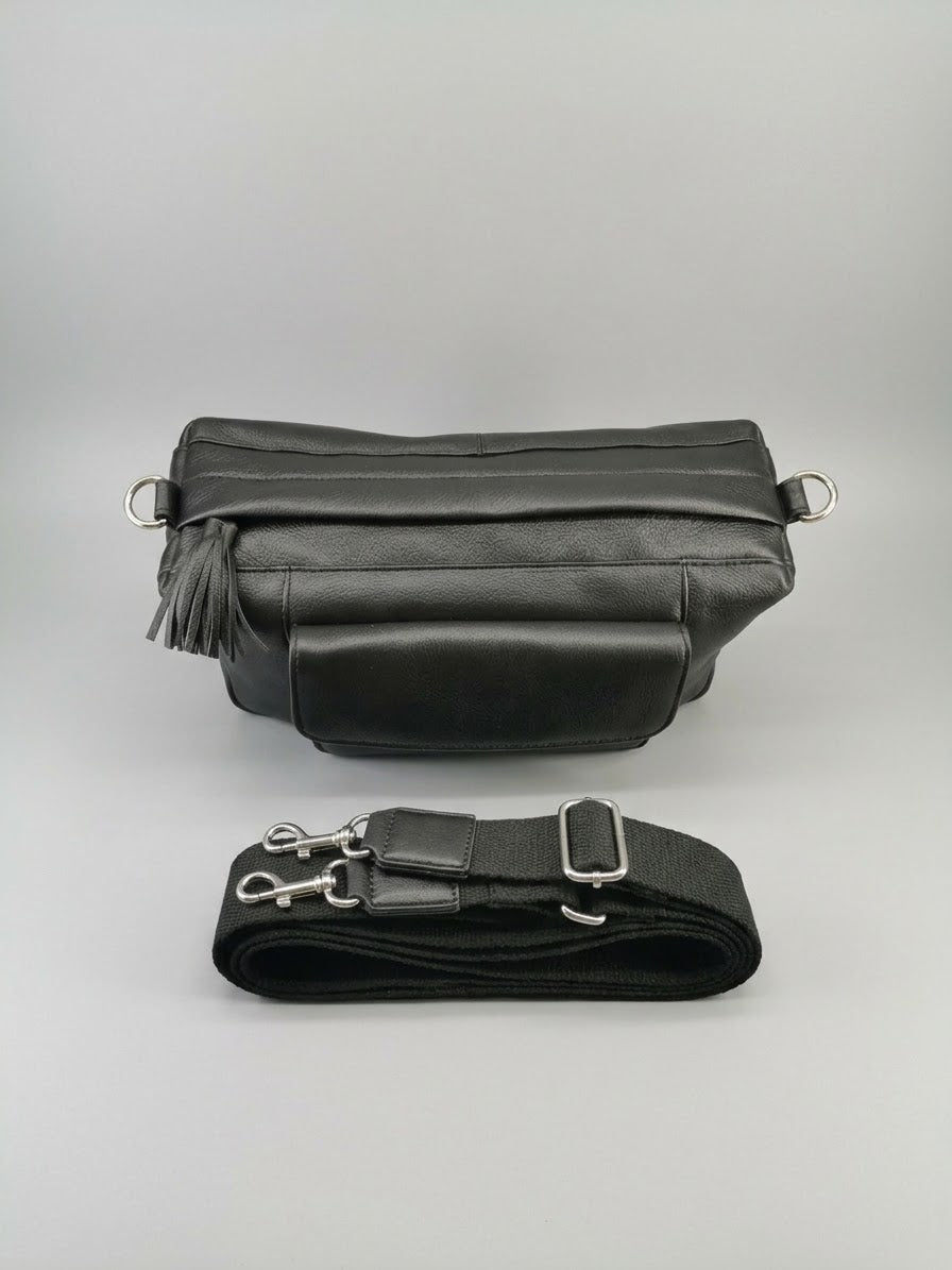 Stile' Nora black leather crossbody bag — flat lay showing detachable wide strap with silver clip hardware