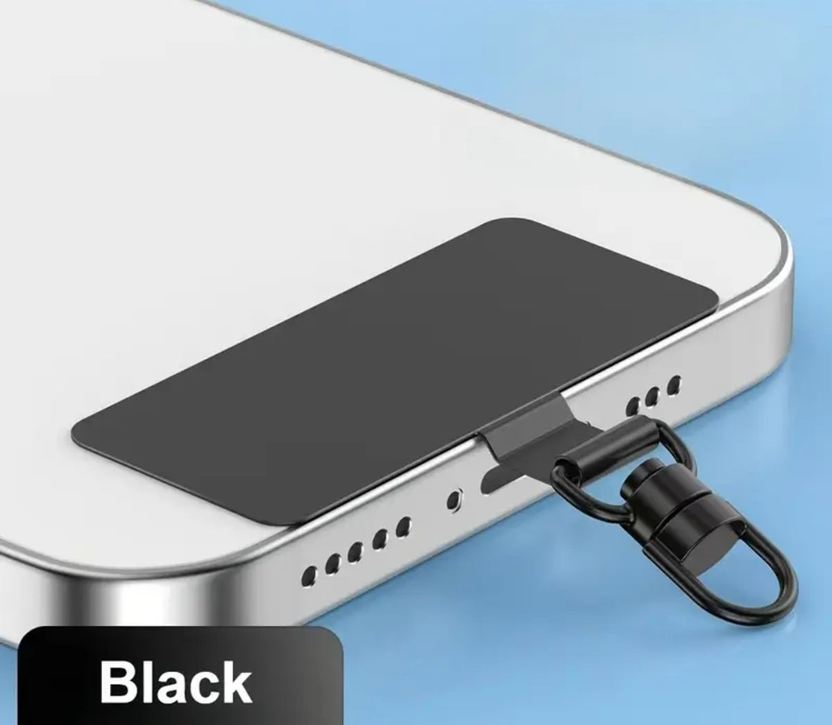 A black metal insert phone strap clip attached to the bottom edge of a silver smartphone, shown on a light blue background with a black label reading 'Black'.