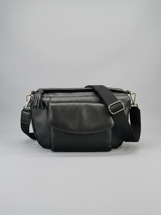 Stile' Nora black leather crossbody bag — front view with wide adjustable strap and leather tassel
