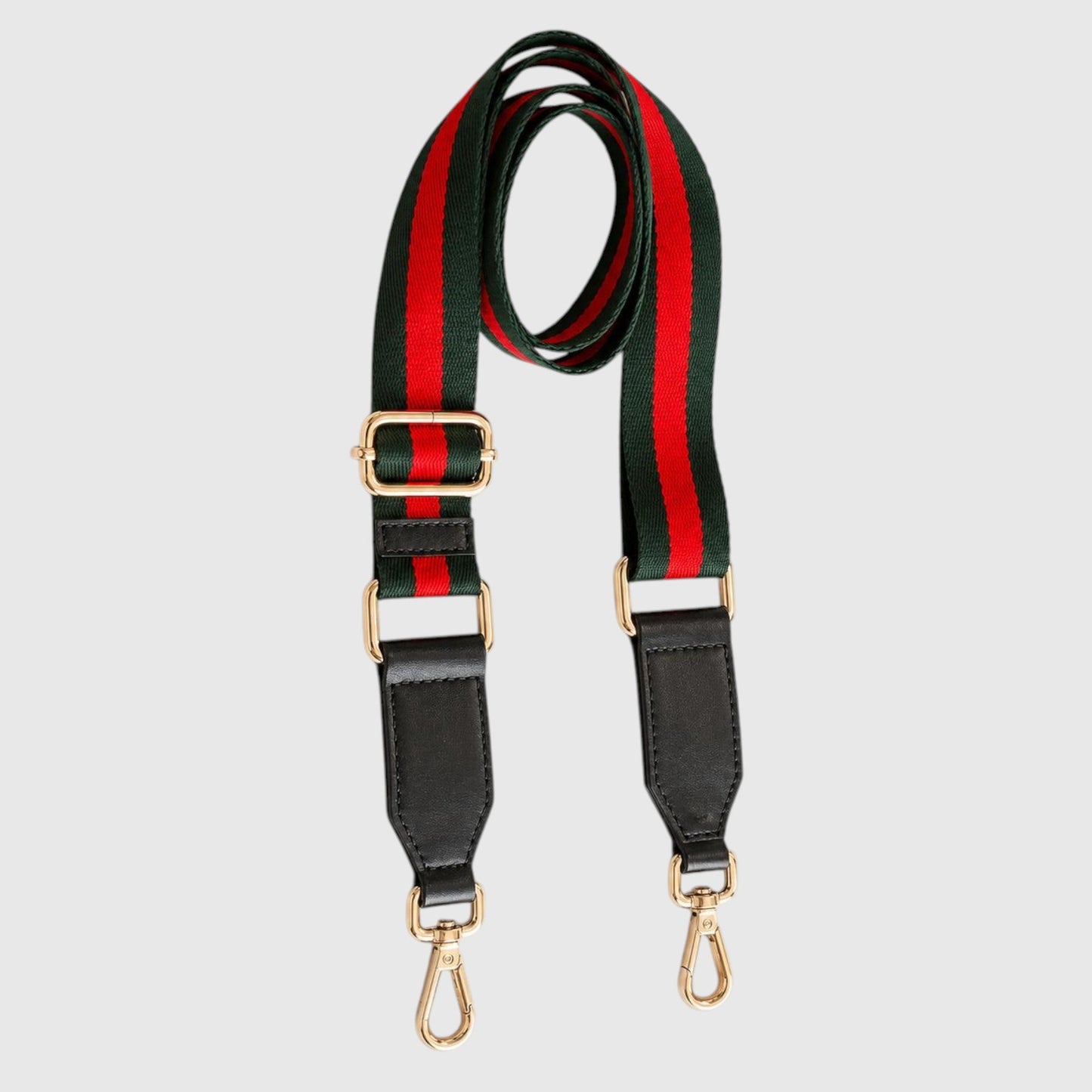 A striped shoulder strap featuring the iconic green and red web stripe pattern, black leather ends, and gold-tone hardware, displayed on a light gray background.